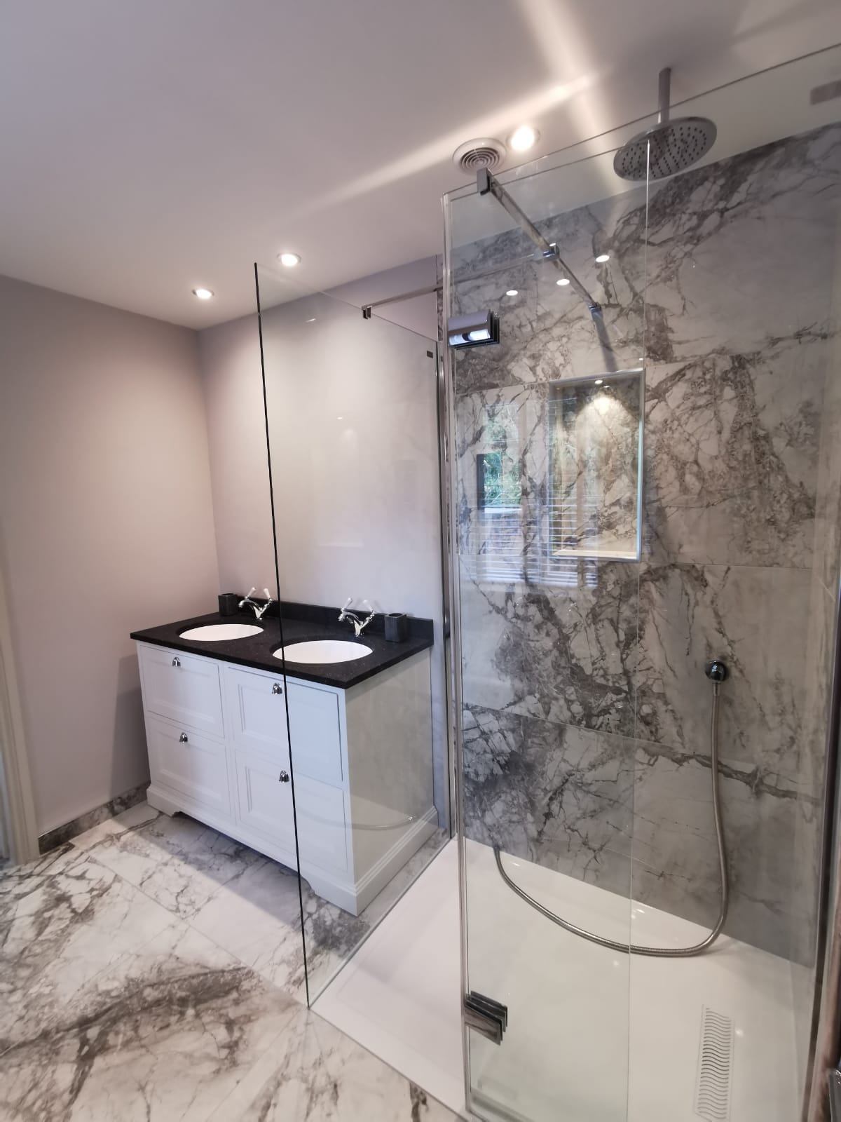 A marble en-suite, plumbed and finished to a high standard